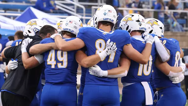 South Dakota State Football Teaser 2026-08 picturing the tight end position group in a pregame huddle.