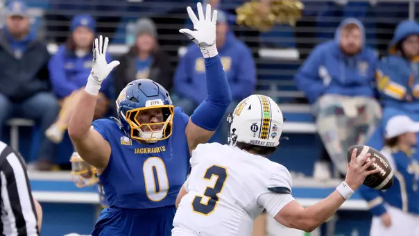 South Dakota State defensive end Carter Sitzman (#0) applies pressure to Murray State quarterback Baxter Wright (#3) during Hobo Day football action at Dana J. Dykhouse Stadium on October 24, 2026, in Brookings, South Dakota.