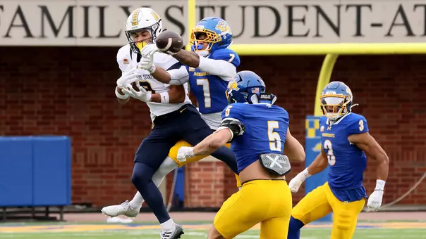 South Dakota State defensive back Noah St-Juste bats away a pass intended for a Murray State receiver during Hobo Day action Oct. 24, 2026, at Dana J. Dykhouse Stadium as Cullen McShane (5) and Dontay Johnson (3) follow the play.