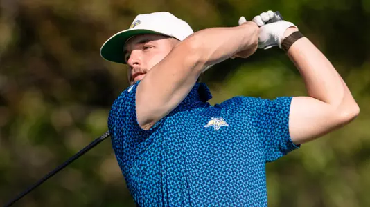Ty Adkins swinging a golf club