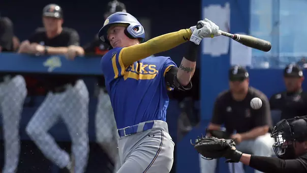Nate Wachter swings at a pitch during home exhibition action in the fall of 2025 at Erv Huether Field.