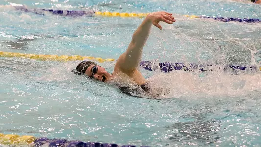 Jenna Currier swims freestyle in home action.
