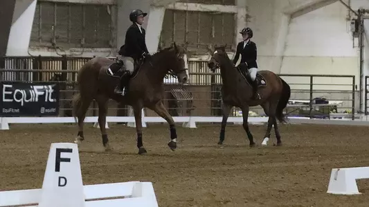 South Dakota State equestrian student-athletes warm up horses in preparation for the flat event in competition against TCU on Feb. 6, 2026, at the DeHaan Equestrian Center in Brookings, South Dakota.