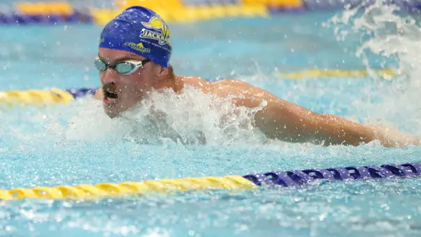 South Dakota State swimmer Braxton McGrath competes in the butterfly events.