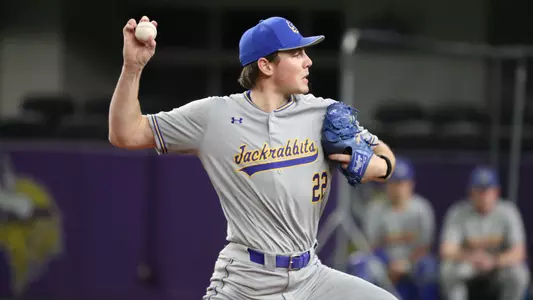 South Dakota State right-handed pitcher Sam Schlecht goes through his motion as he sends a pitch to home plate in action March 7, 2026, against Minnesota.