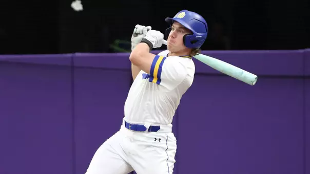 South Dakota State baseball player Mason Lang watches the flight of the ball after making contact on a swing in action against Northwestern on March 6, 2026, at the Cambria Classic played at U.S. Bank Stadium in Minneapolis, Minnesota.