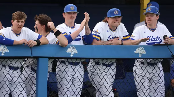 South Dakota State baseball players cheer on teammates from the dugout during action against North Dakota State on March 20, 2026, at Erv Huether Field in Brookings, South Dakota.