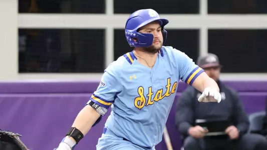Dayton Franke follows through on his swing and starts running to first base after making contact on a pitch in action March 8, 2026, against Southern Illinois at the Cambria Classic played at U.S. Bank Stadium in Minneapolis, Minnesota.