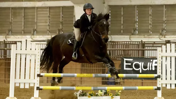 South Dakota State jumping seat rider Juliana Gullo competes in the fences category during home competition at the DeHaan Equestrian Center.