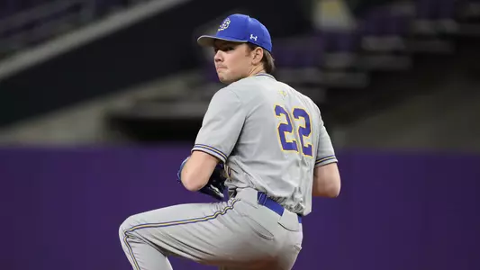 Sam Schlecht goes through his windup during action against Minnesota on March 7, 2026, at the Cambria Classic inside U.S. Bank Stadium in Minneapolis.