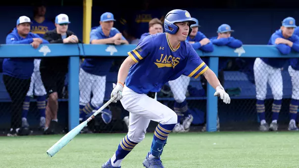 Nolan Grawe begins to run to first base on his way to a two-run triple in action against Midland (Neb.) on April 14, 2026, at Erv Huether Field in Brookings, South Dakota.
