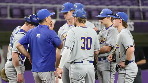 South Dakota State baseball players and head coach Rob Bishop discuss strategy at the pitcher's mound during action earlier in the 2026 season at the Cambria Classic played inside U.S. Bank Stadium in Minneapolis, Minnesota.