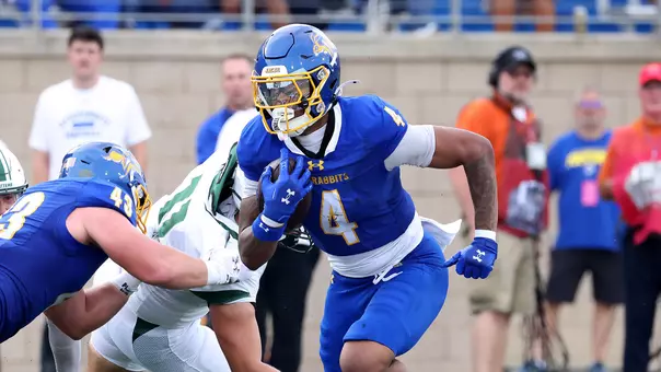 South Dakota State running back Corey Blair Jr. runs through the Stetson defense after receiving a block from tight end Andrew Gustad during season-opening action Aug. 29 at Dana J. Dykhouse Stadium in Brookings, South Dakota.