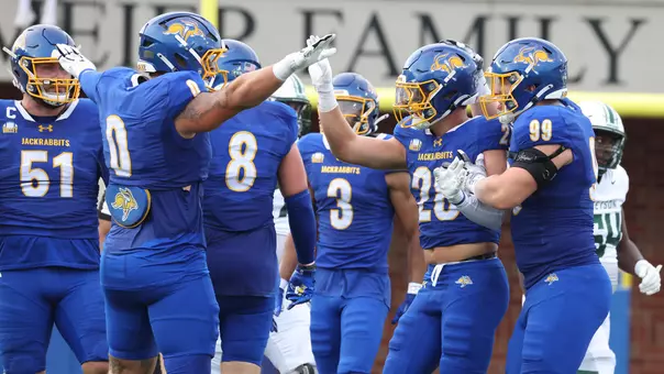 South Dakota State defensive football players celebrate forcing a turnover against Stetson in the 2026 season opener played Aug. 29 at Dana J. Dykhouse Stadium.