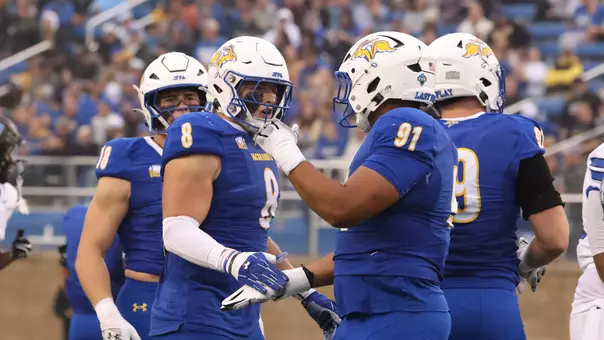 South Dakota State football players Reis Kirschenman (8) and Jace Sifore (91) congratulate each other after a play against Eastern Illinois on Sept. 26, 2026, at Dana J. Dykhouse Stadium.