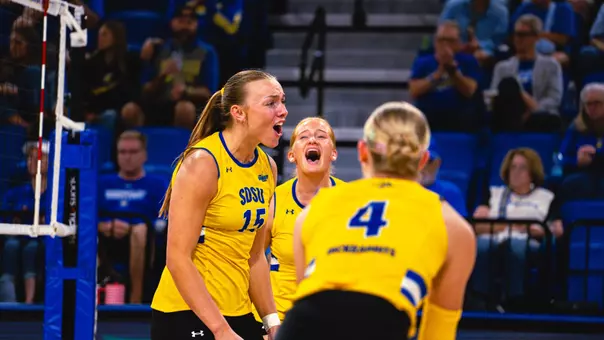 Brooklyn Meyer celebrates in a yellow jersey after scoring a point,.