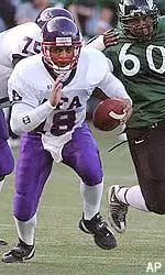 Quarterback Michael Williams scrambles from Portland State's Agatupu Sagapolutele (60) during the second half Saturday.