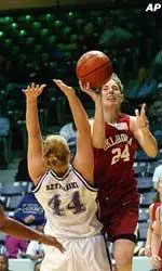 Oklahoma's Leah Rush drives to the basket over the defense of Stephen F. Austin's Stacy Szymanksi.