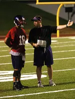 SFA QB Michael Williams works with coach Scott Reed.