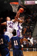 Matt Kingsley and Kyle Jacobs go up for a rebound in SFA's home opener against Houston Baptist