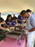 SFA seniors serve a barbecue meal to the Lumberjack Marching Band Thursday.