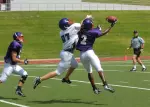 Senior Stephon Rhea picks off a pass during a preseason scrimmage.