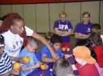 Members of the Ladyjack basketball and softball teams participate in pumpkin carving at Boys and Girls' Club.