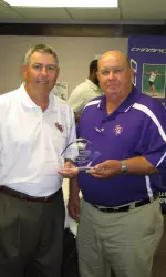 SFA Director of Athletics Robert Hill honors Victor Shepherd at a luncheon Monday afternoon.