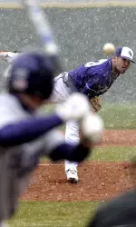 Cory Ochs delivers a pitch amidst constant snow in Sunday's win over Northwestern State.