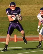 Sophomore Ryan Gambel scores one of six TDs for the purple squad Saturday night.