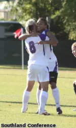 Kylie Louw and Chelsea Raymond celebrate a goal in SFA's 2-1 win over ORU on Friday.
