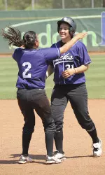 Freshman Kaitlyn Mixon (right) is congratulated by Linda Linares following her game-winning against UTA Saturday.