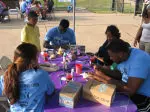 SFA SAAC helps decorate TOMS shoes with local children.