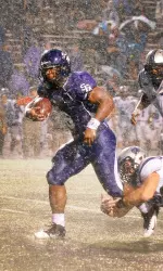 Johnson rushes for 215 yards on a rain-soaked evening in Nacogdoches.