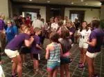 Members of the Ladyjacks sign autographs to youngsters Friday evening.