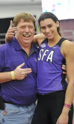 Payne and her coach Jeff Erickson after breaking the NCAA record on Saturday
