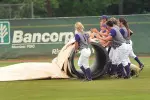The Ladyjacks had to pull tarp twice before lightning officially postponed Friday's game