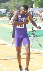 My'Lik Kerley reacts after running the final leg of SFA's winning 4x400 meter relay
