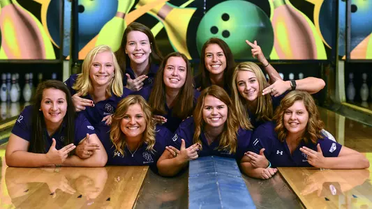 Bowling_Team_on_Lanes_Lying_Down