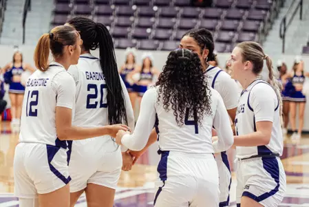 Team huddled during match against Wiley