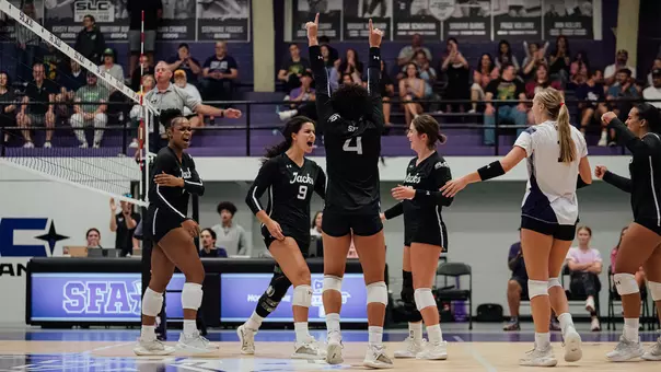 ladyjacks celebrating after a point against southeastern louisiana