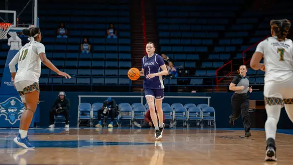 myka perry dribbling the ball against UNO
