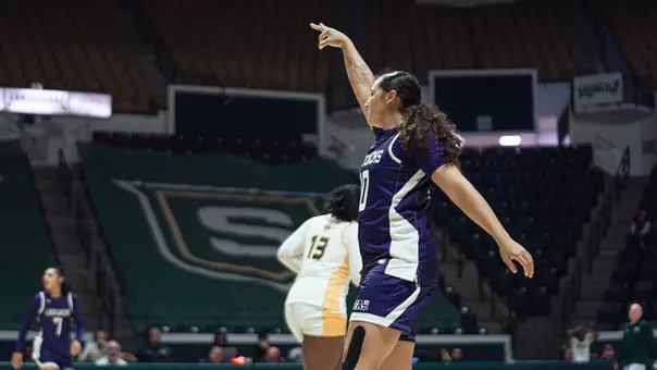 Harmanie Dominguez celebrating a three-pointer at SLU