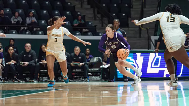 Anika Hyland driving to the basket at SLU