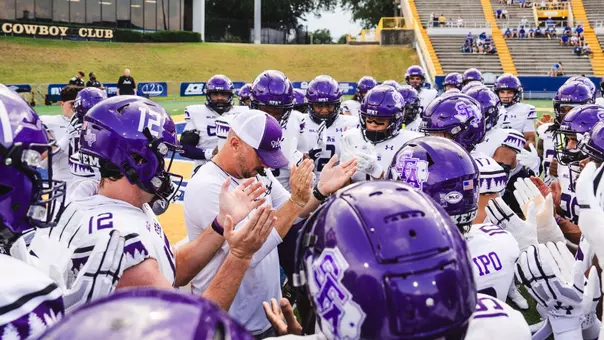 Coach Carthel with Team vs. McNeese (8-29-26)