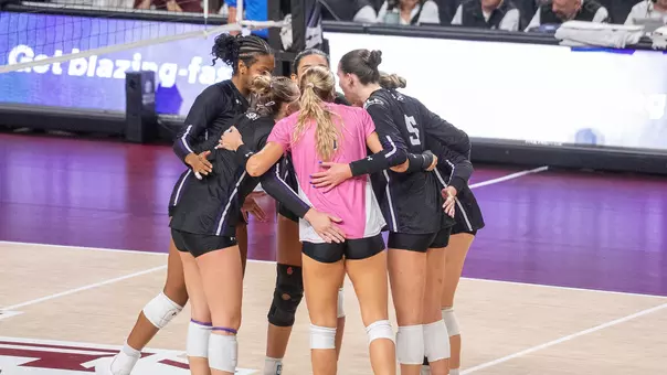 Team in huddle at Texas A&M (9.15.26)