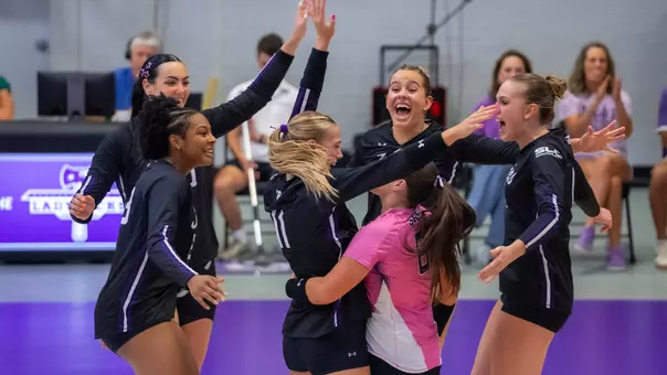 Team celebrating after point vs Texas State (9.10.26)