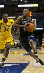 Sterling Gibbs drives for the basket in front of Marquette Golden Eagles guard-forward Deonte Burton.  (Jeff Hanisch-USA TODAY Sports)