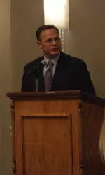 John Morris addresses the room.