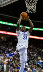 Freshman Angel Delgado narrowly missed his third double-double of the season (13 points, 9 rebounds)